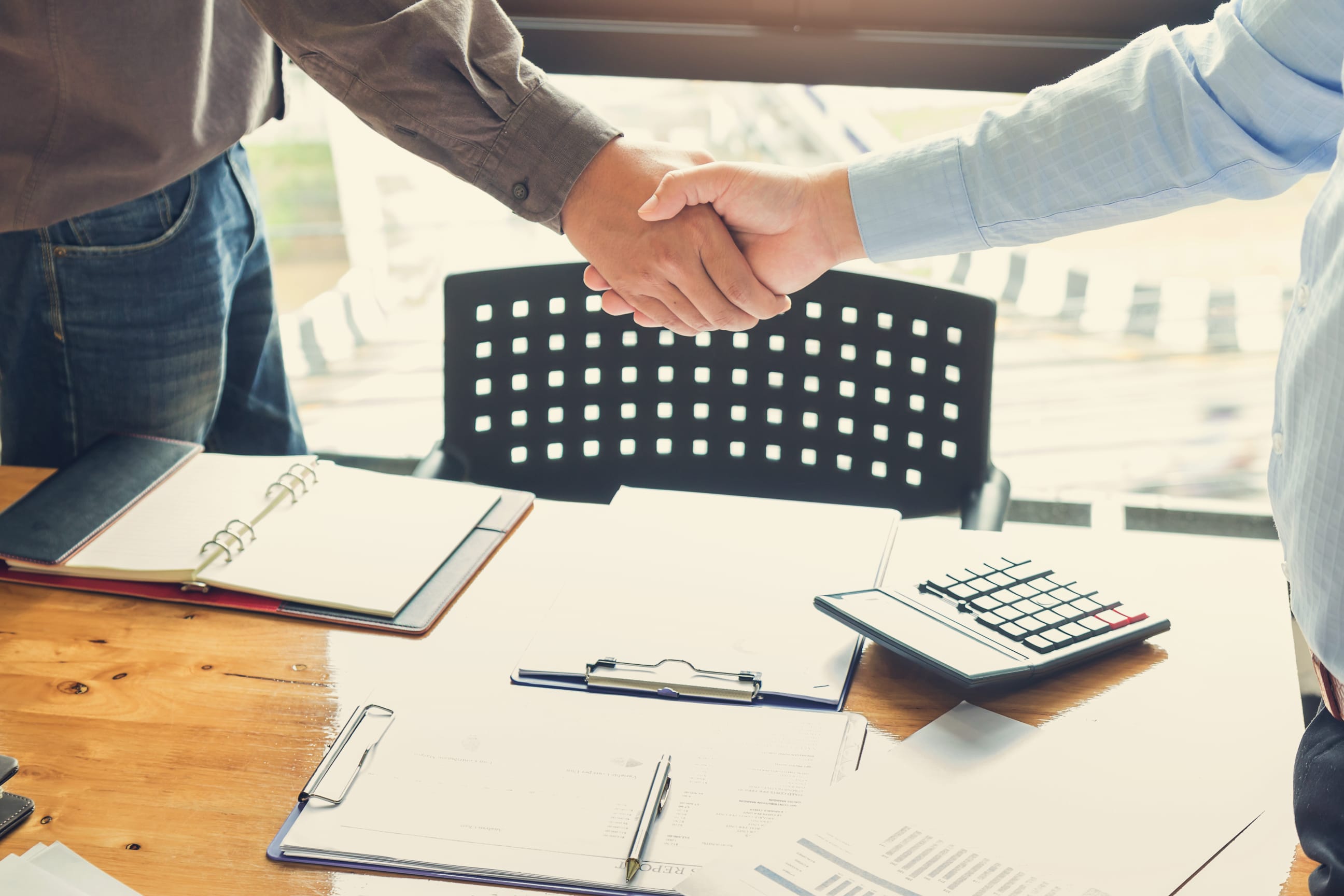 business people meeting around table with charts